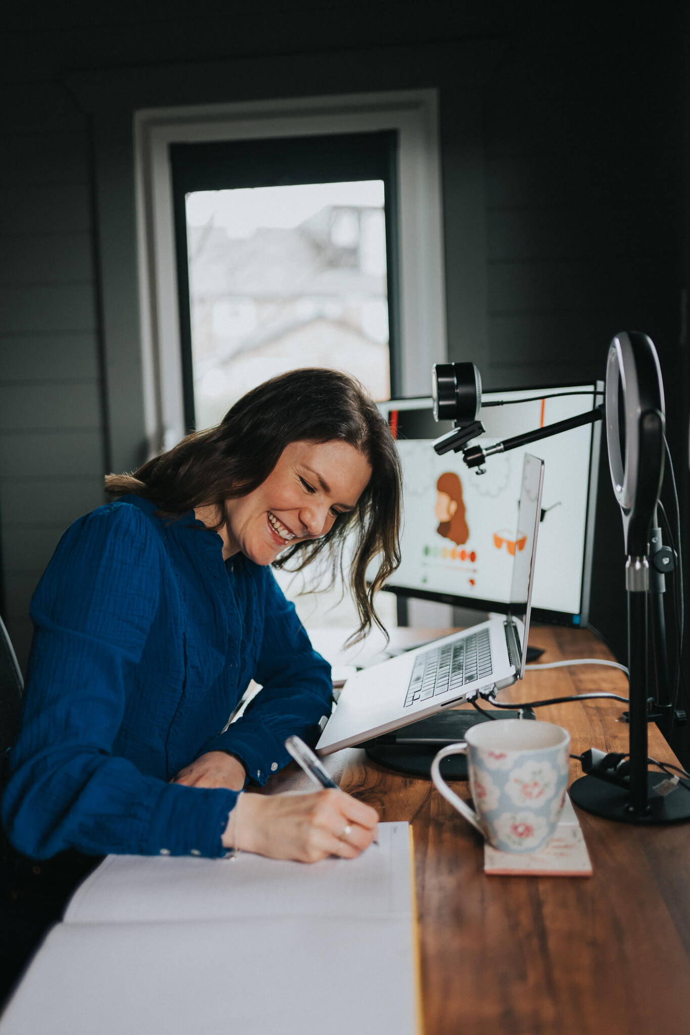 Michelle writing at her desk